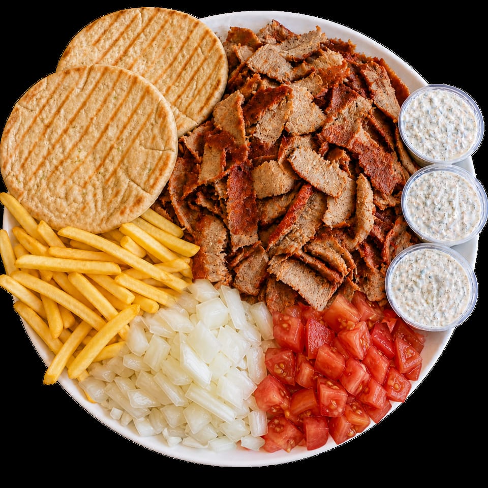 A large platter of gyro meat, pita bread, french fries, diced onions, tomatoes, and tzatziki sauce.