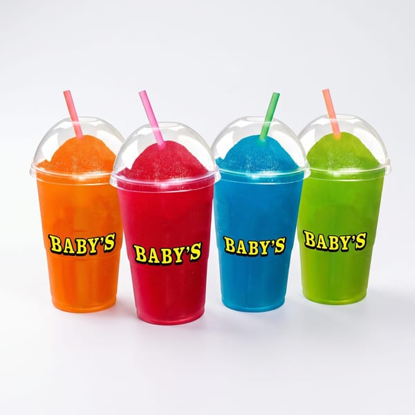 Four Baby's brand slushies in orange, red, blue, and green with straws.